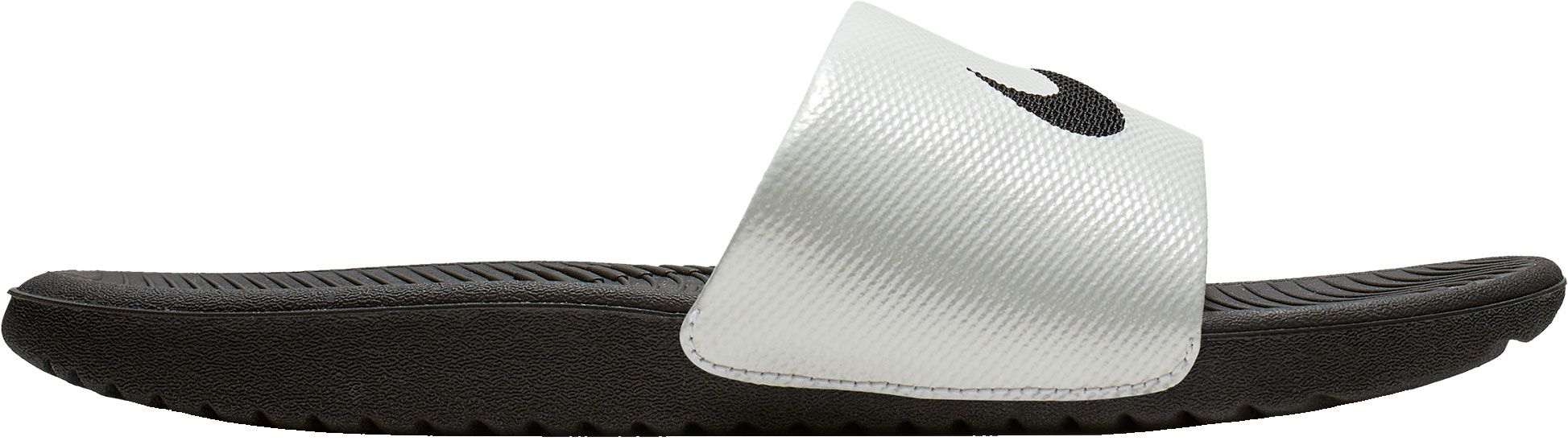 white and silver nike slides