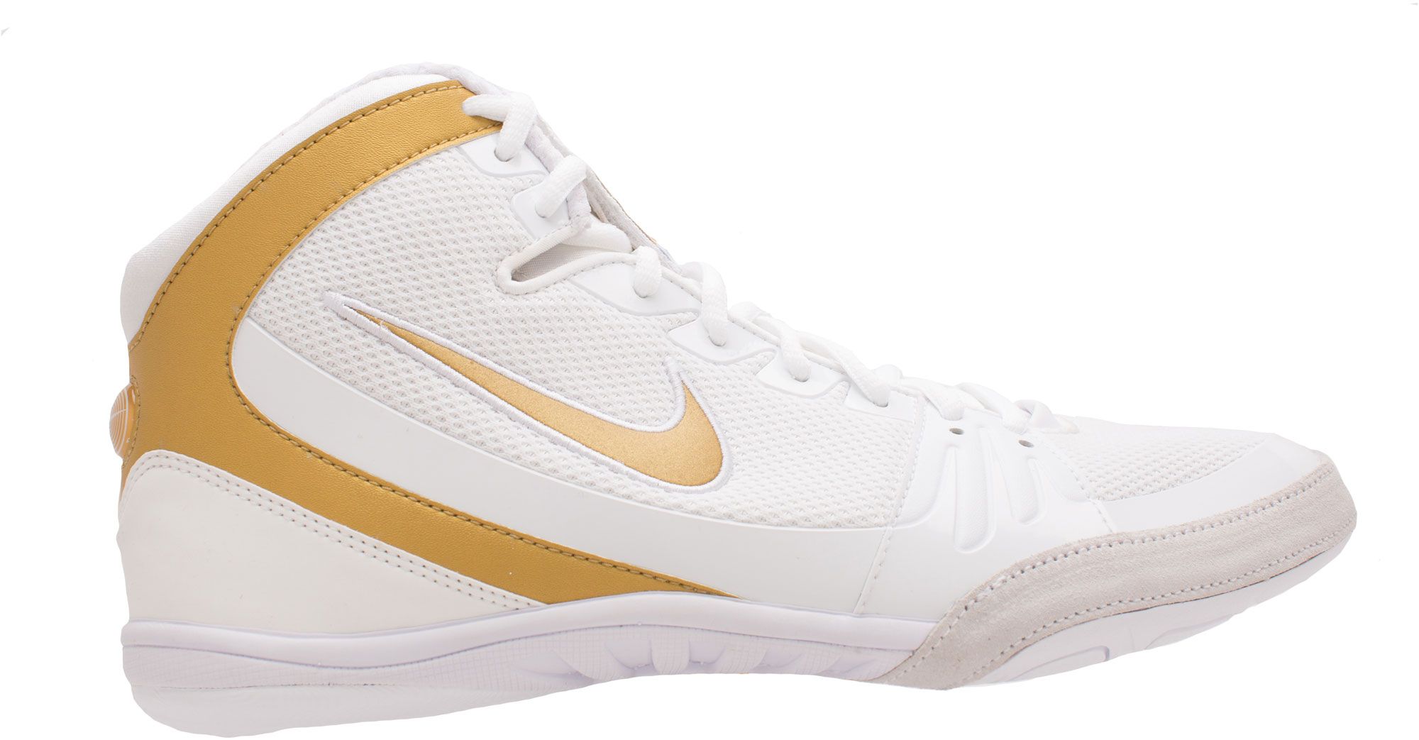 white and gold nike freeks