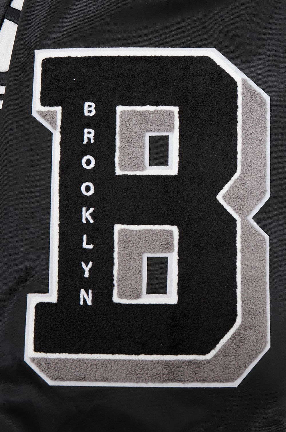 Pro Standard Men's Brooklyn Nets Black Old English Ribbed Satin Jacket product image
