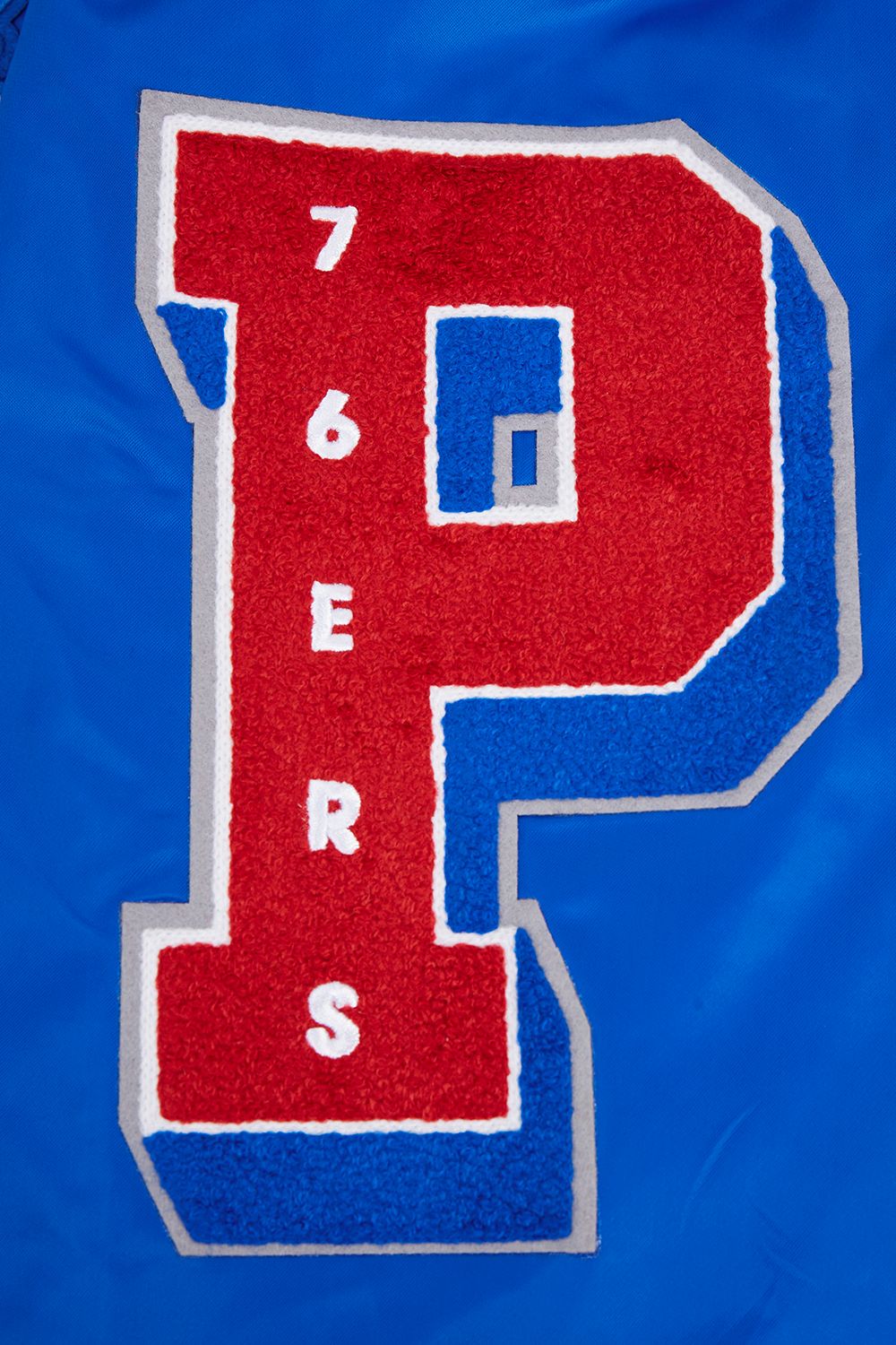 Pro Standard Men's Philadelphia 76ers Royal Old English Ribbed Satin Jacket product image