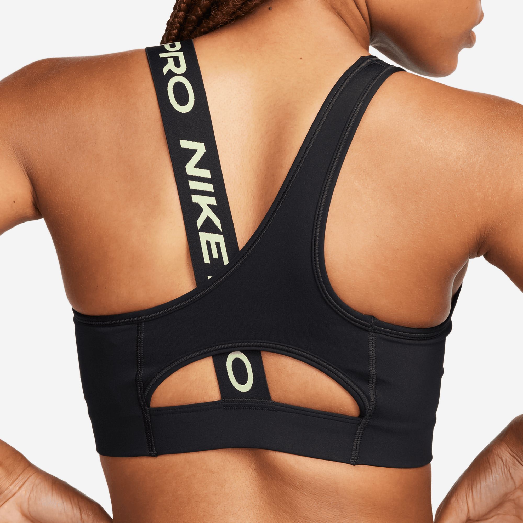 Nike Pro Training swoosh asymmetric sports bra in black and yellow