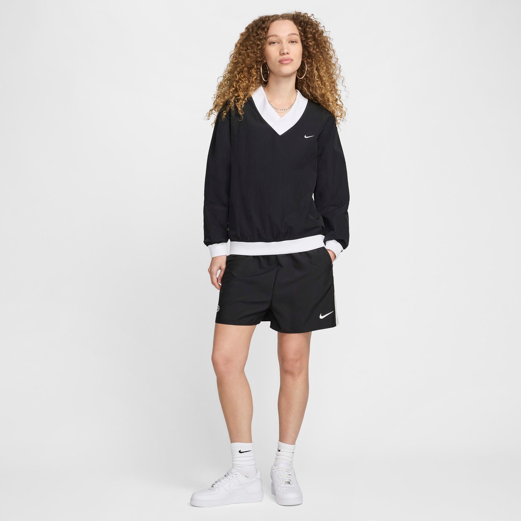 Nike Women's Sportswear Essential Loose UV Woven Long-Sleeve V-Neck Top product image