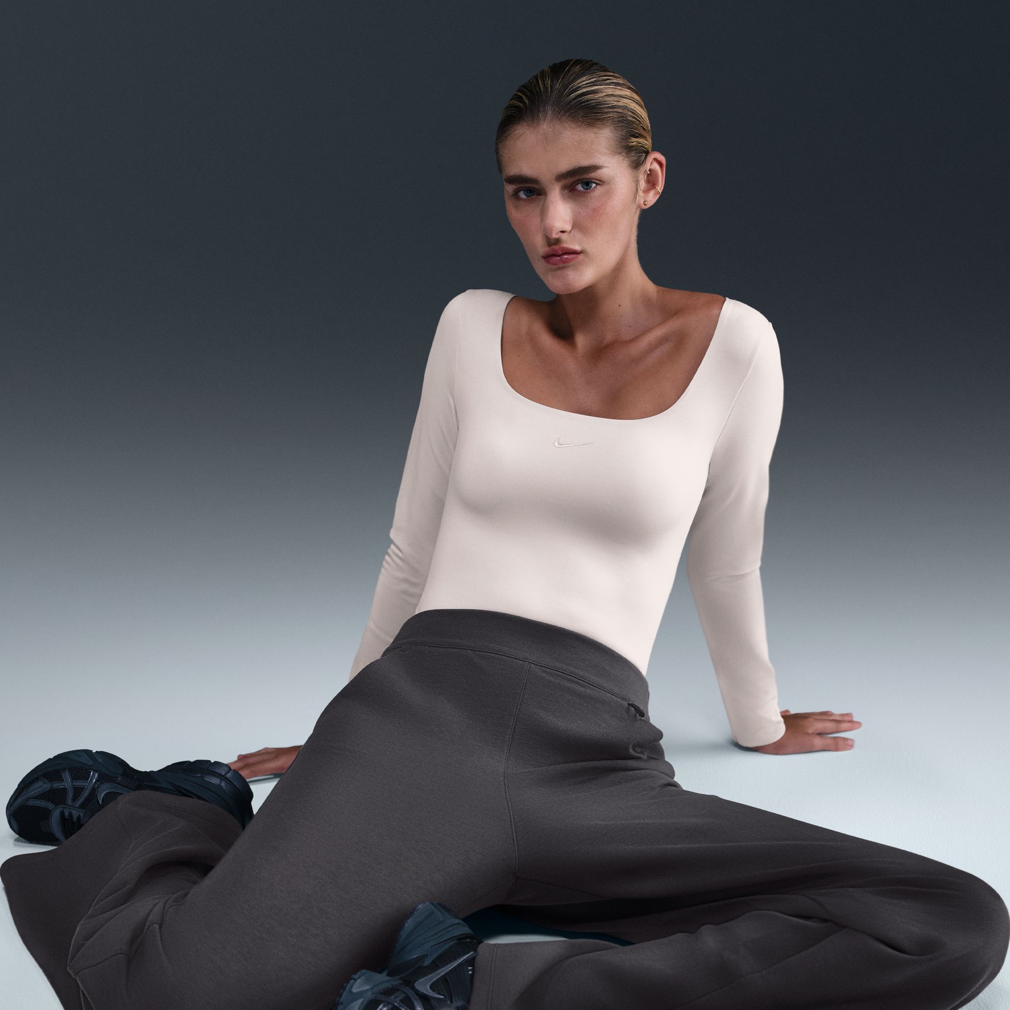 Nike Women's 24.7 ImpossiblySoft Dri-FIT High-Waisted Loose Flared Pants product image