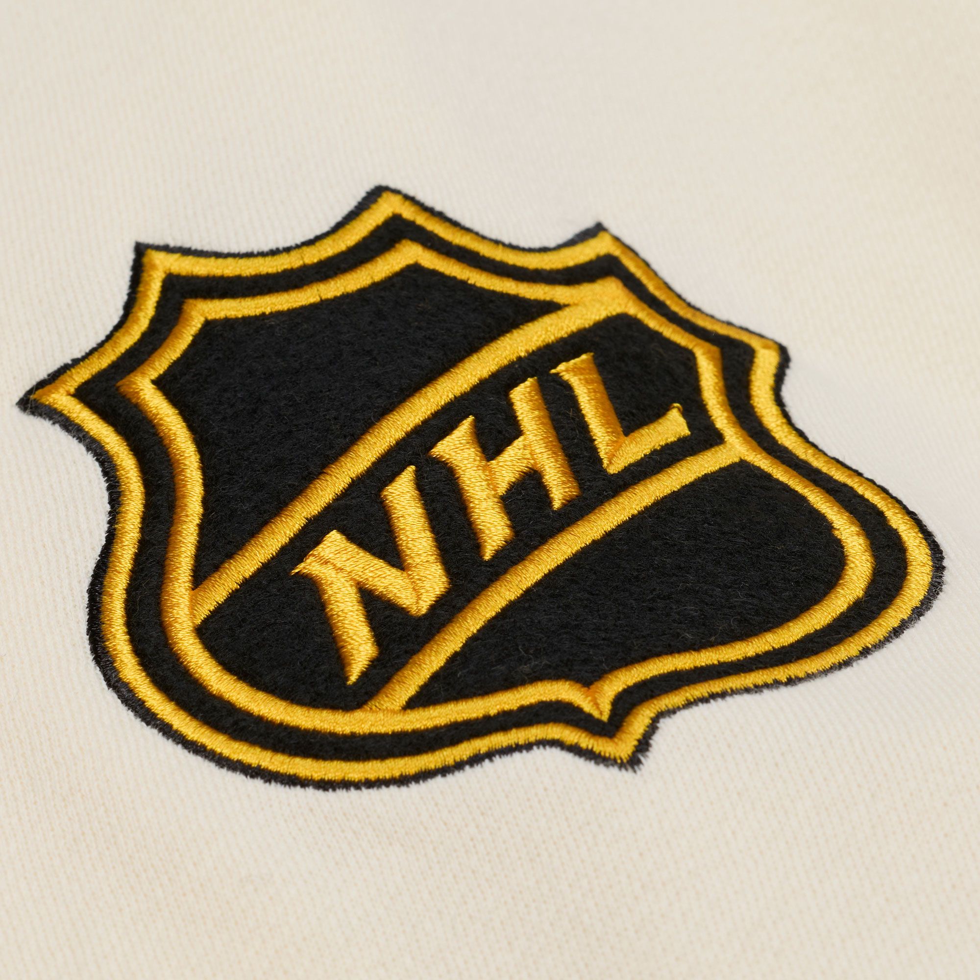 Mitchell & Ness Men's Boston Bruins Tan Dusted Varsity Jacket product image