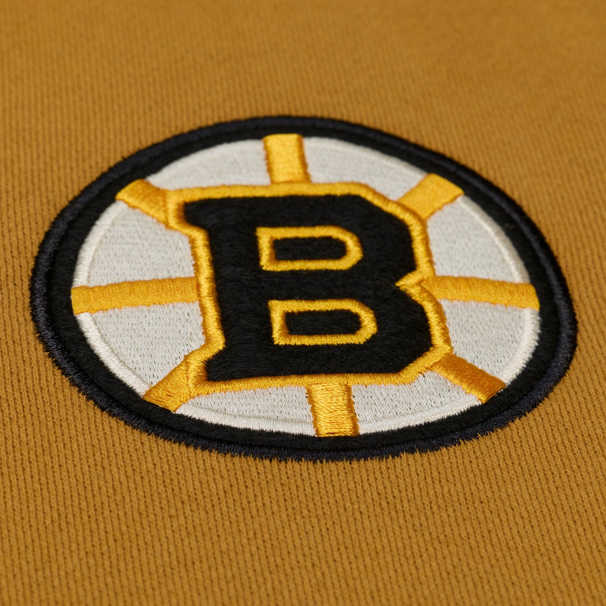 Mitchell & Ness Men's Boston Bruins Tan Dusted Varsity Jacket product image