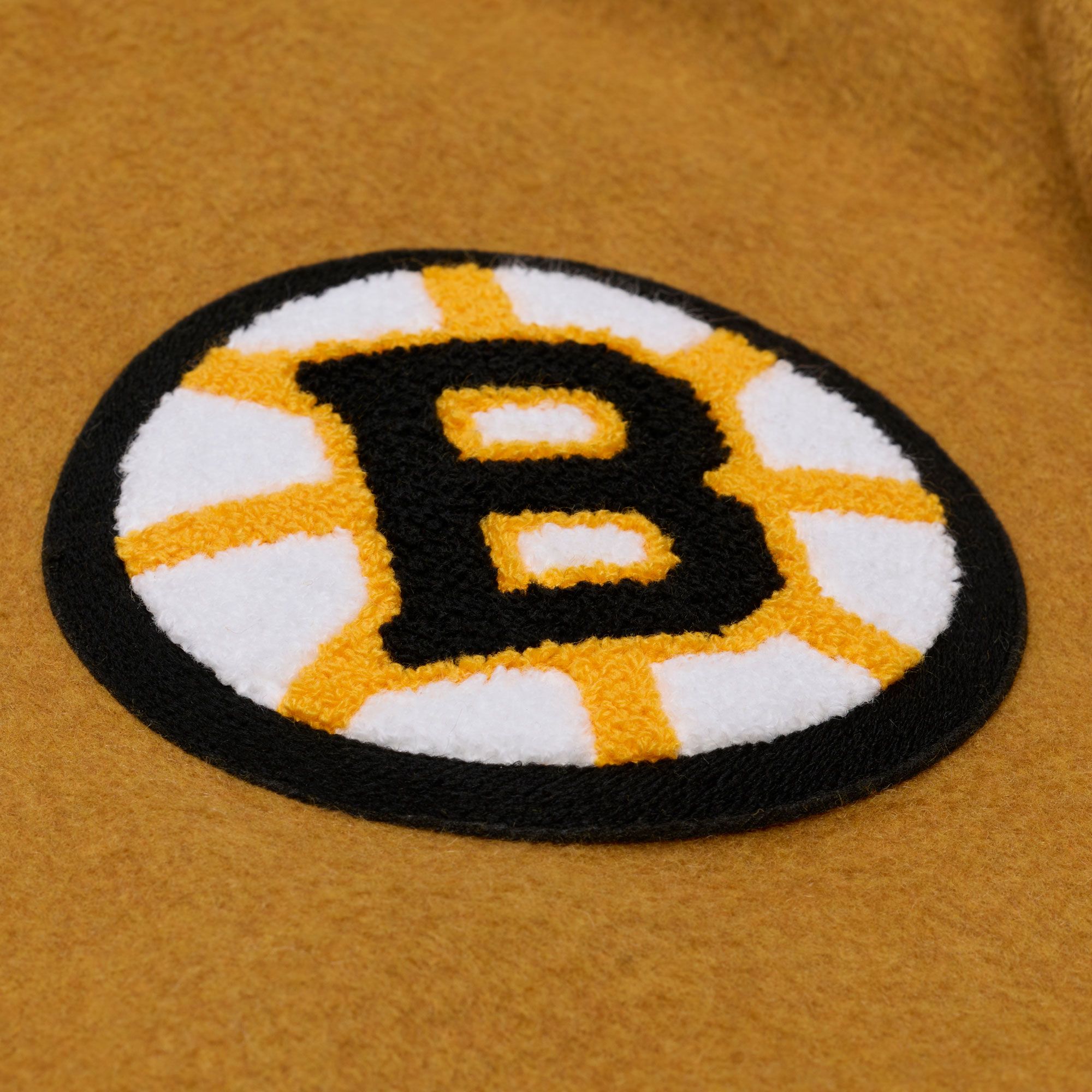 Mitchell & Ness Men's Boston Bruins Tan Dusted Varsity Jacket product image