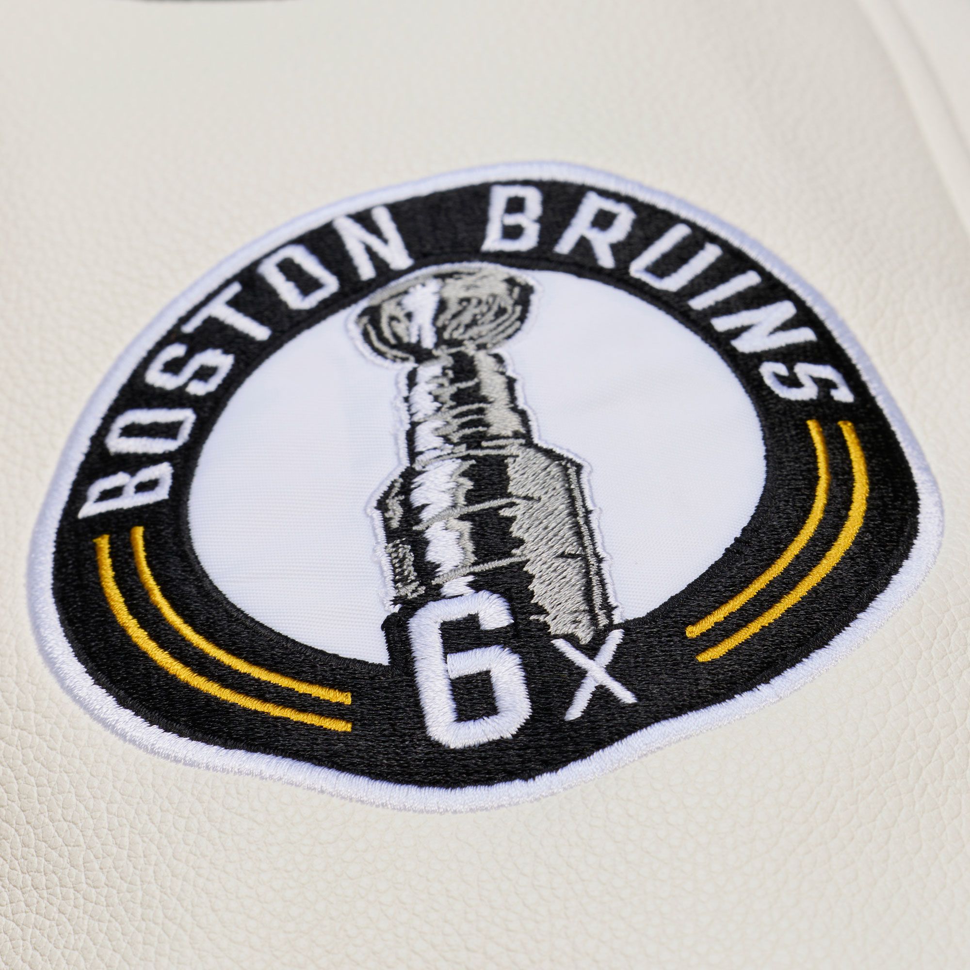 Mitchell & Ness Men's Boston Bruins Tan Dusted Varsity Jacket product image