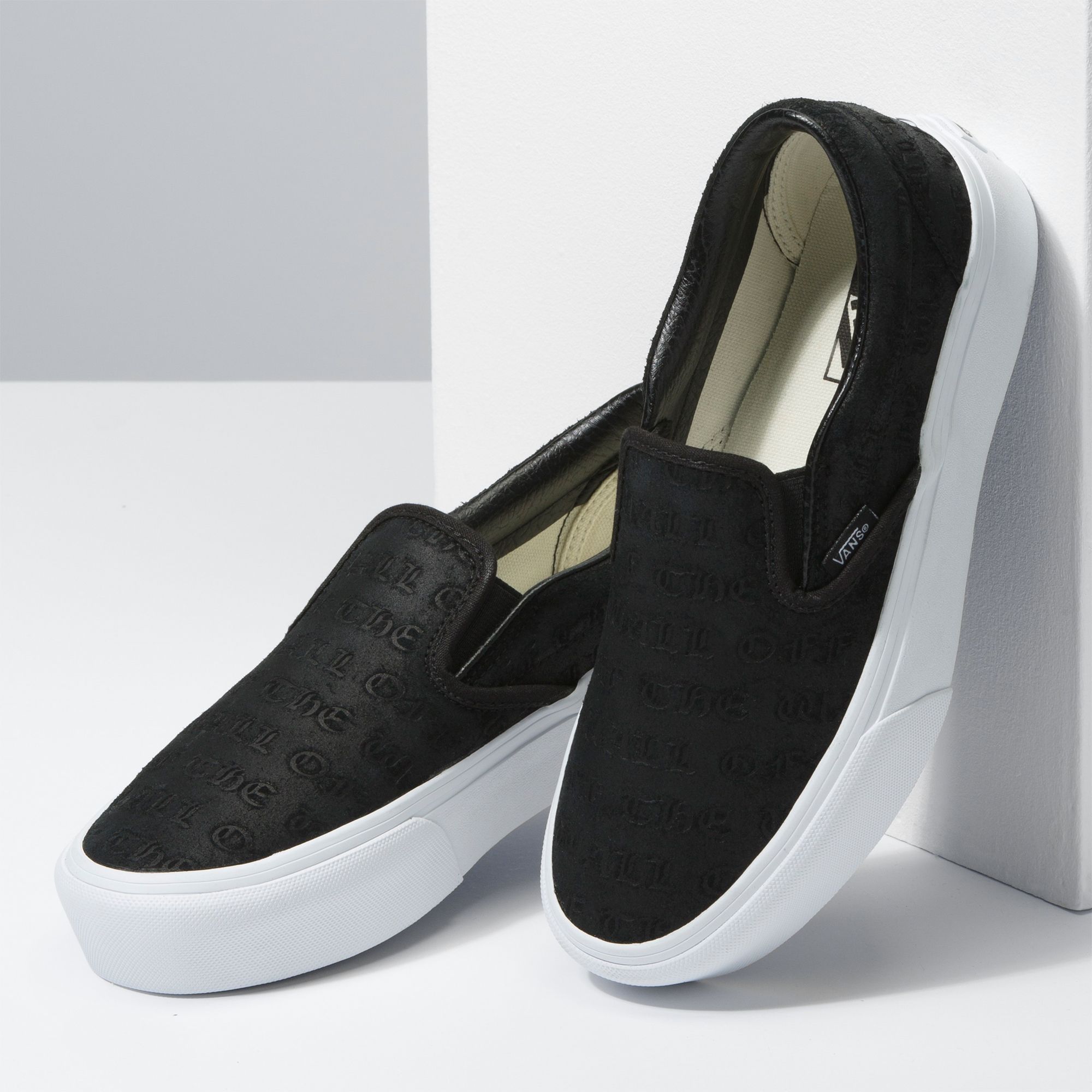 vans black platform slip ons