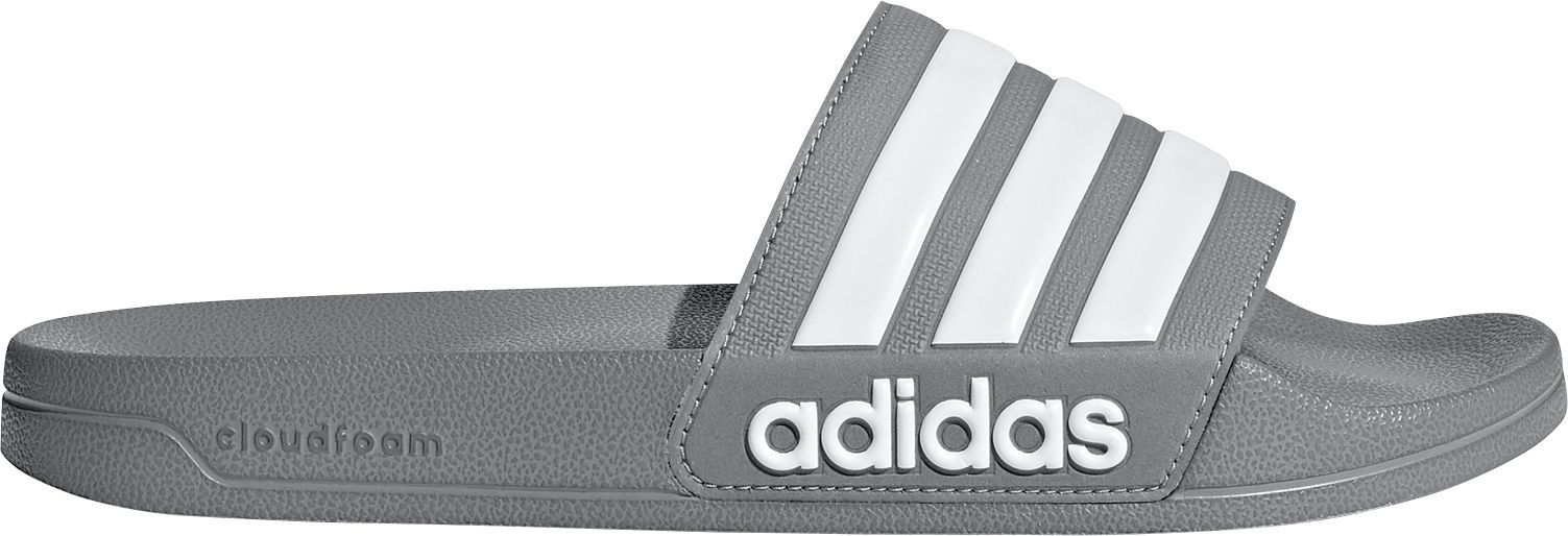 grey and white adidas slides