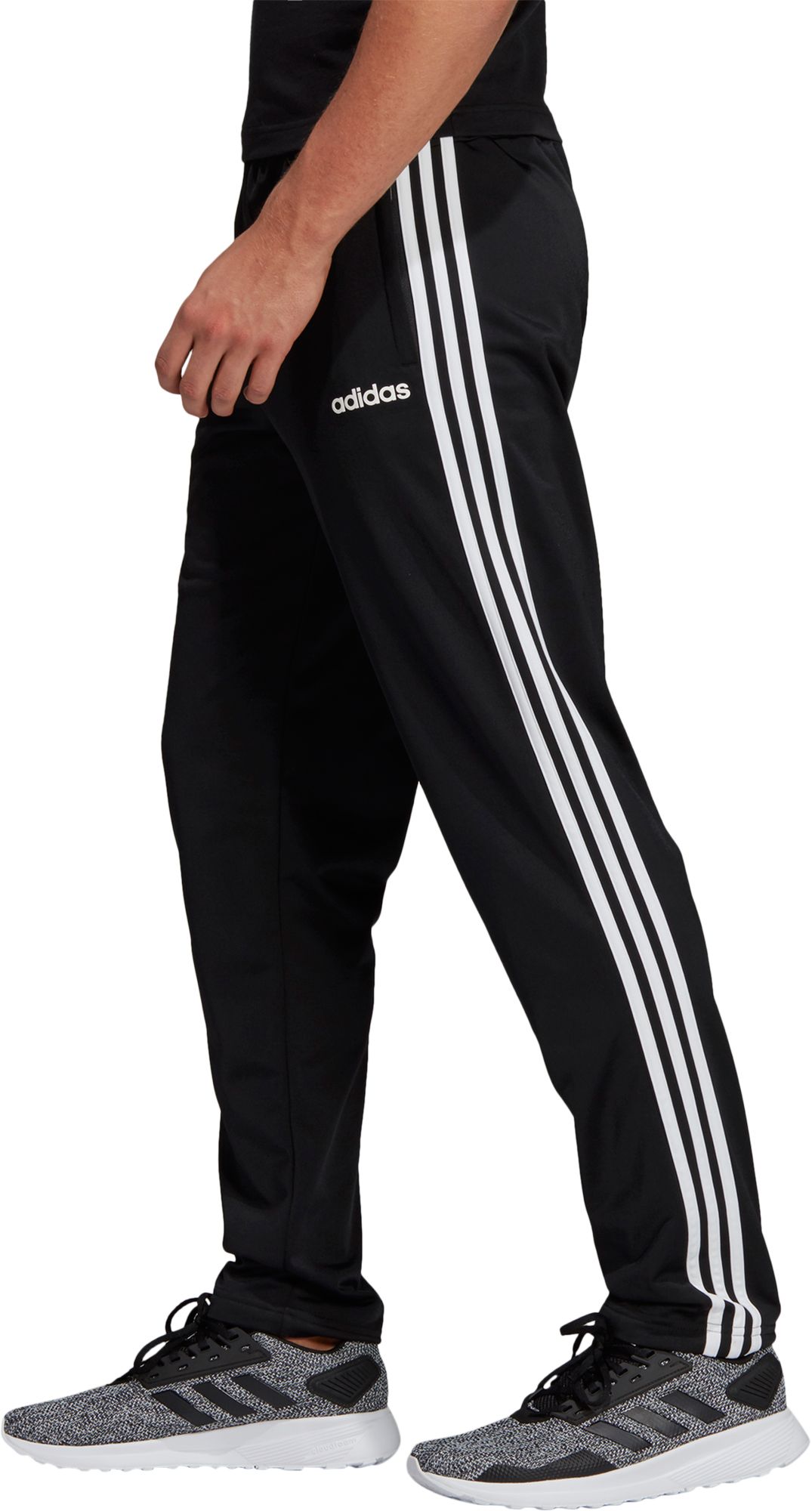 black adidas pants with black stripes