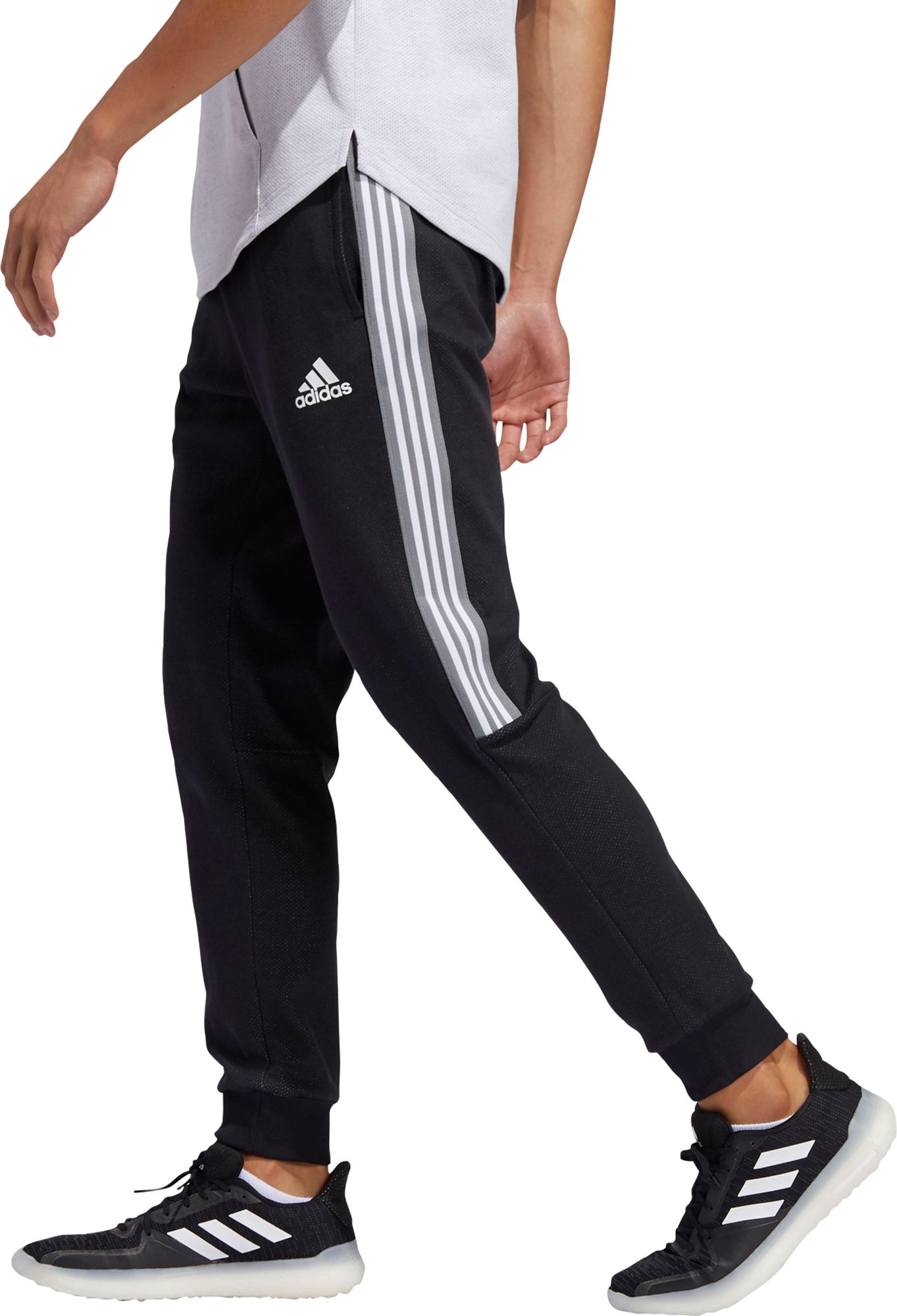 half striped adidas joggers