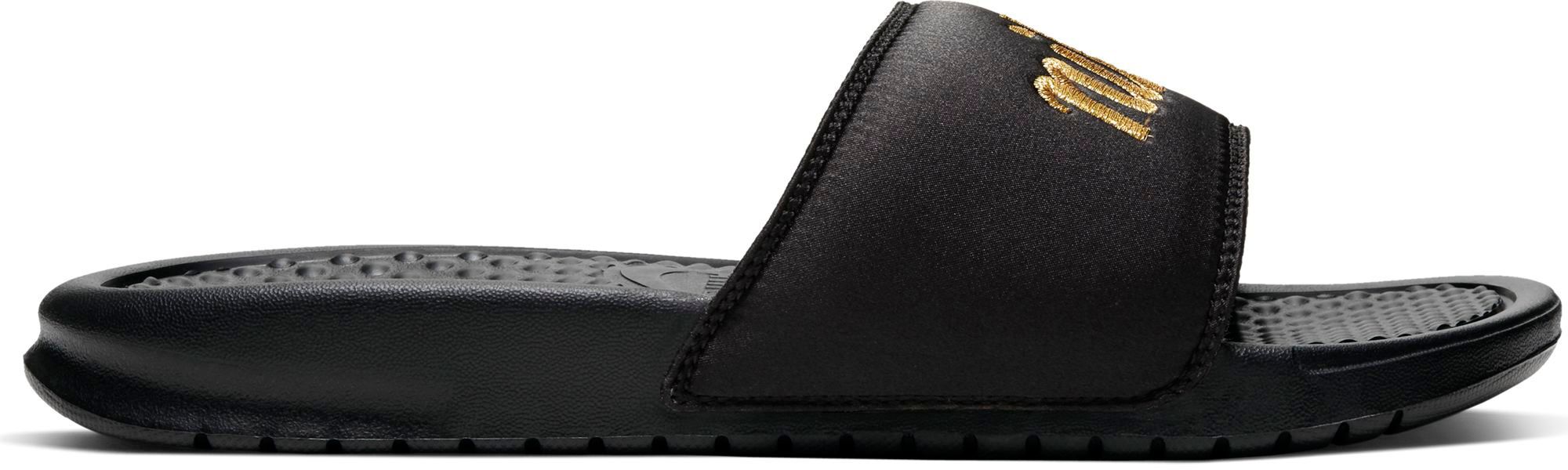 black nike slides with gold check