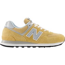 New Balance 574 sneakers in triple white with gum sole
