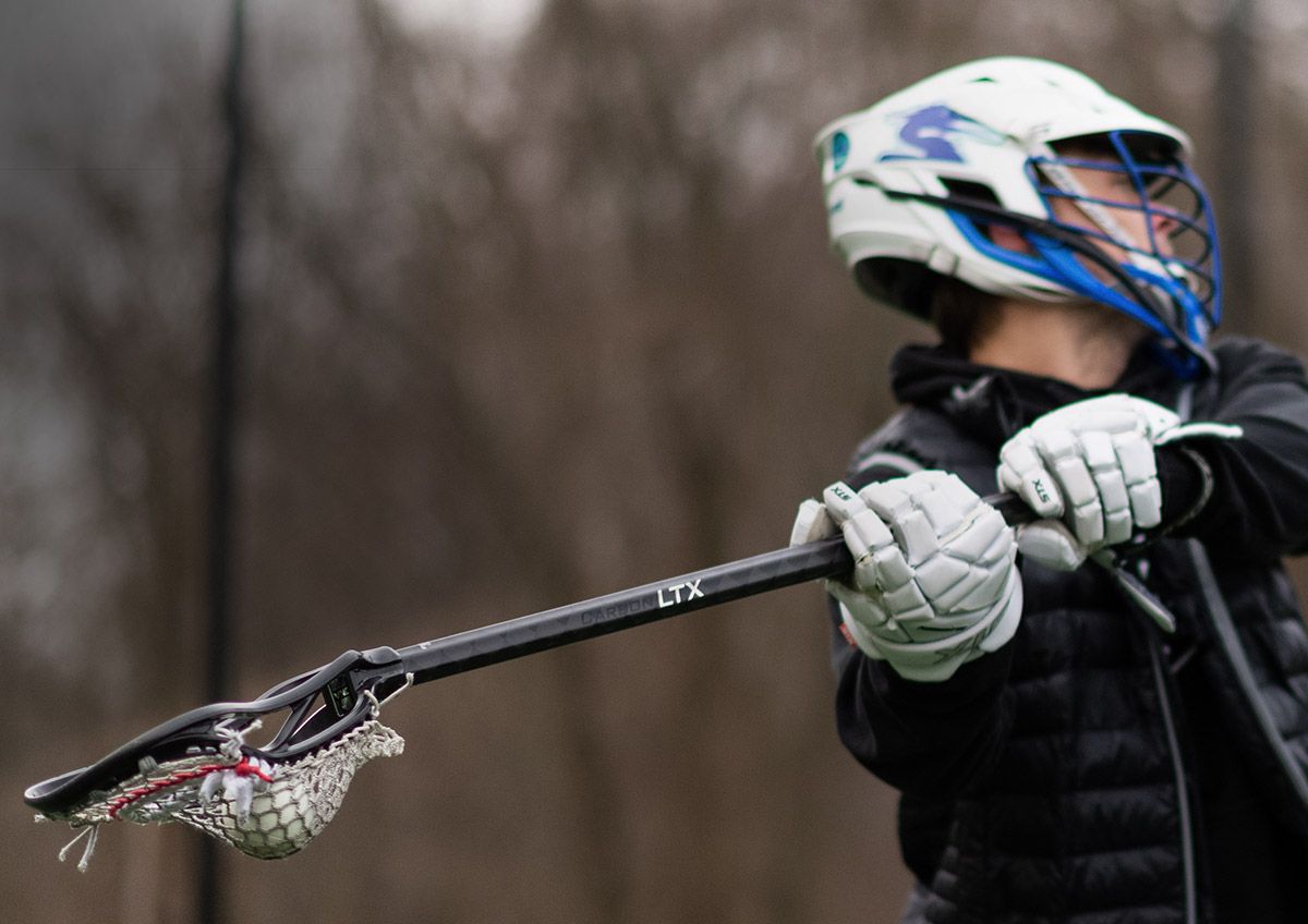 A field lacrosse player using a stick featuring the ECD Carbon LTX.