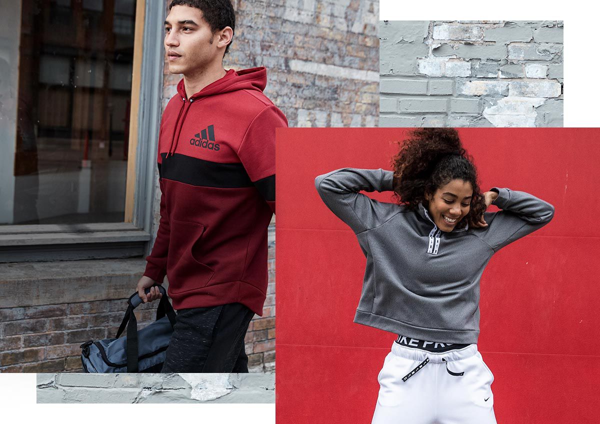 A man wearing the adidas post game retro hoodie and a woman wearing the Nike Women's All Time Half-Zip and Nike Women's All Time Zip Pants.