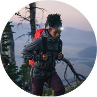 Person hiking while wearing headlamp